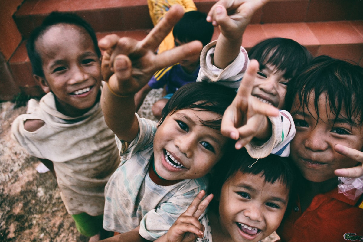 Smiling children reaching out